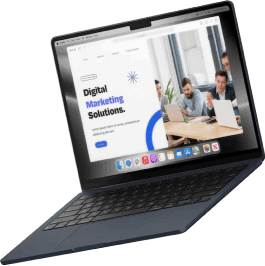 A black laptop is open, displaying a website with the text Digital Marketing Solutions, featuring advanced analytics and an image of three people working together on laptops in an office setting.