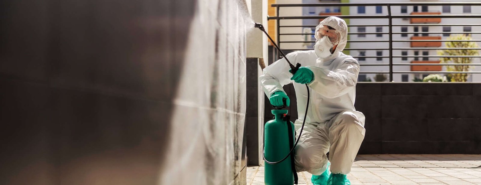 Disinfectant worker in protective gear sanitizing a terrace, with Droved’s local SEO and AI search optimization helping cleaning and sanitation companies get found on Google Maps and AI platforms.